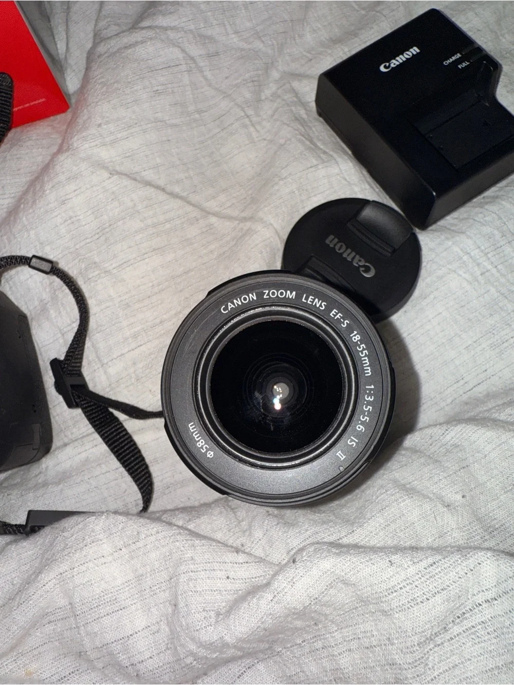 Canon DSLR Camera in Black with Red Strap Accent